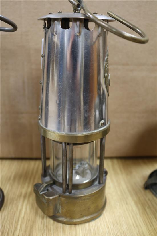 Two miners lamps and a bicycle lamp